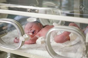 18310942-Newborn-baby-inside-incubator-in-hospital-Stock-Photo-premature